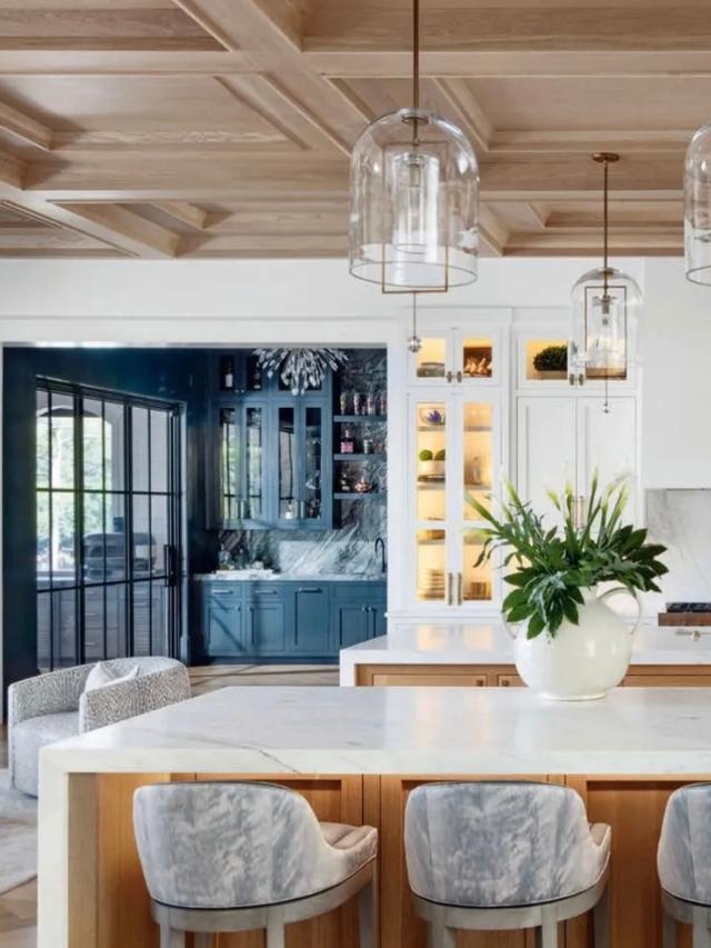 Kitchen with white oak coffered ceiling and marble island